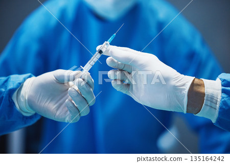 Surgery, nurse hands doctor syringe with medicine and surgical procedure, closeup and healthcare in hospital. Health insurance, needle and injection with drugs and surgeon people in operating room 135164242
