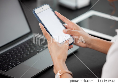 Hands, mockup and closeup of a woman with a phone networking on social media or mobile app. Technology, communication and female person browsing on the internet with cellphone with mock up space. Hands, mockup and closeup of a woman with a phone networking on social media or mobile app. Technology, communication and female person browsing on the internet with cellphone with mock up space. 135164638