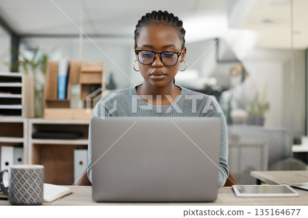 Laptop, office and business black woman typing online for research, internet and browse website. Corporate, professional and female worker busy on computer working on report, project and planning Laptop, office and business black woman typing online for research, internet and browse website. Corporate, professional and female worker busy on computer working on report, project and planning 135164677