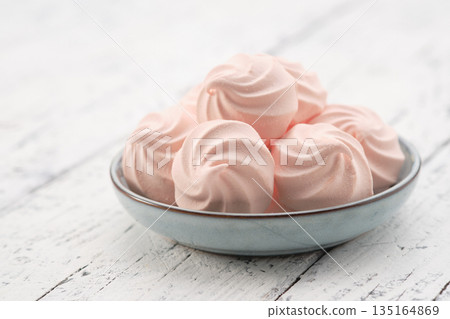 Homemade gentle marshmallows on blue plate close up. Homemade gentle marshmallows on blue plate close up. 135164869