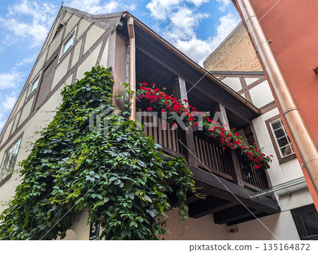 Beautiful balcony decorated with geranium flowers Beautiful balcony decorated with geranium flowers 135164872
