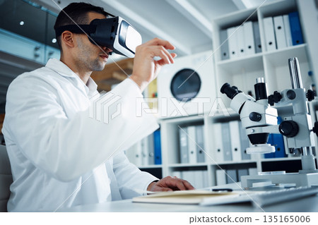 Man, scientist and VR goggles with metaverse, futuristic tech and science innovation in lab. Virtual reality, medical research and UX with future technology, scientific experiment and male doctor 135165006