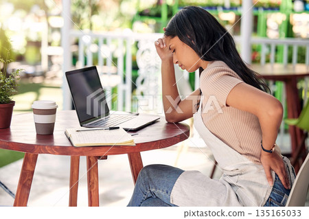 Woman in pain with laptop at garden table, outdoor cafe or plant shop with stress, burnout and back ache. Mental health, small business owner and computer, worry with injury in florist restaurant. 135165033