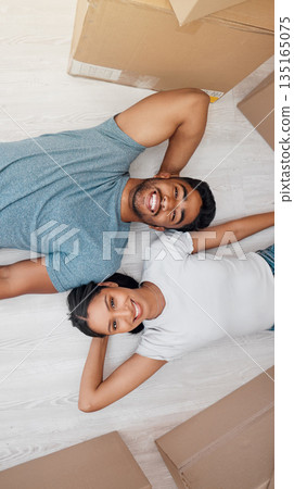 Top view, home and couple with boxes, real estate and excited on the floor, living room and mortgage. Portrait, man and woman on the ground, cardboard and relationship with property and apartment Top view, home and couple with boxes, real estate and excited on the floor, living room and mortgage. Portrait, man and woman on the ground, cardboard and relationship with property and apartment 135165075