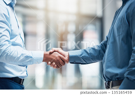 Thank you, businesspeople shaking hands and at office of their workplace together with a lens flare. Partnership or agreement, crm or greeting and colleagues with a handshake for interview at work Thank you, businesspeople shaking hands and at office of their workplace together with a lens flare. Partnership or agreement, crm or greeting and colleagues with a handshake for interview at work 135165459