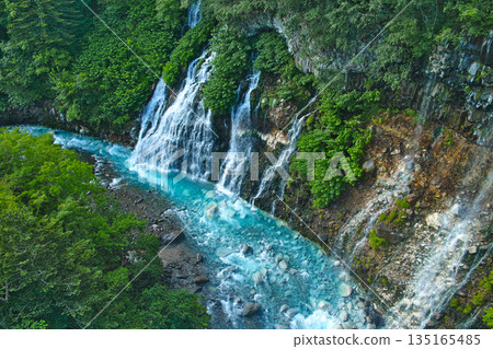 Shirahige Falls and the blue river in early summer: a spectacular view of Biei, Hokkaido Shirahige Falls and the blue river in early summer: a spectacular view of Biei, Hokkaido 135165485