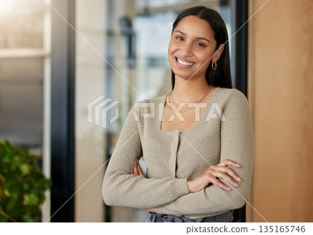Portrait, arms crossed and business woman, designer or professional in office workplace. Face, creative and smile of female entrepreneur or confident design person from India with pride for career. Portrait, arms crossed and business woman, designer or professional in office workplace. Face, creative and smile of female entrepreneur or confident design person from India with pride for career. 135165746