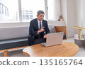 Lounge, office worker, meeting, smartphone, gimbal, venture, senior, executive, middle-aged, executive, video streaming 135165764