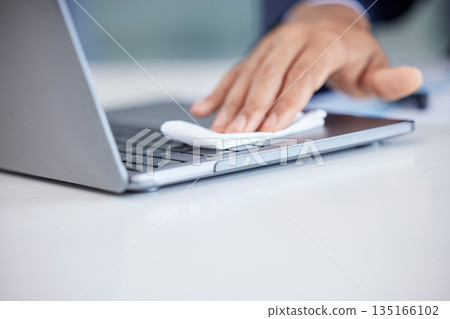 Closeup, business and hands cleaning, laptop and wiping with hygiene, bacteria and disinfecting. Male person, professional and dust with technology, pc and cloth for germs, prevention and sanitize 135166102