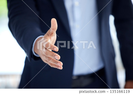 Business, man and hand with negotiation in closeup for an interview with entrepreneur at a company. Professional male, welcome and meeting with an offer with trust and support for hiring at office. Business, man and hand with negotiation in closeup for an interview with entrepreneur at a company. Professional male, welcome and meeting with an offer with trust and support for hiring at office. 135166119