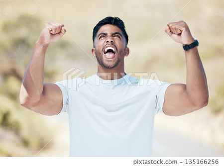 Man, fitness and fist in celebration for winning, achievement or workout exercise and training in nature outdoors. Happy and excited male person, athlete or runner in joy for cardio, win or victory 135166256
