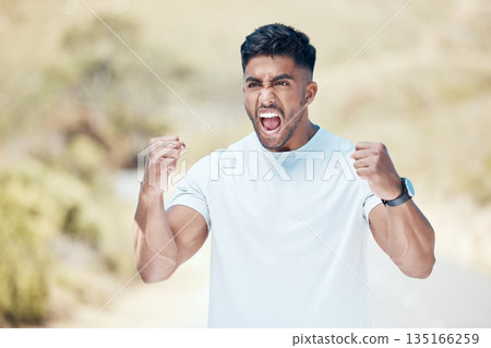 Man, fitness and fist in nature for celebration, winning or achievement from workout, exercise or training outdoors. Happy and excited male person, athlete or runner in joy for cardio, win or victory 135166259