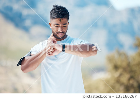 Health, smartwatch and athlete training heart rate for outdoor sports, marathon or cardio strength with mountain exercise. Fitness, watch and young man or runner on a hike workout for wellness 135166267