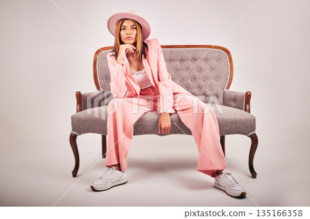 Portrait, fashion and confident woman on sofa in studio isolated on a white background mockup. Serious, stylish and female model on couch or chair from Brazil with cool clothes, pink hat and relax. Portrait, fashion and confident woman on sofa in studio isolated on a white background mockup. Serious, stylish and female model on couch or chair from Brazil with cool clothes, pink hat and relax. 135166358
