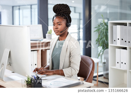 Call center, computer and black woman typing for telemarketing, customer service or support. Contact us, crm or African female sales agent, consultant or person focus on business in help desk office. 135166626