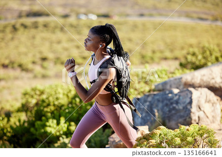 Black woman, mountain runner and outdoor for fitness, speed or challenge for wellness with focus in summer. African girl, workout and running for training, sunshine and exercise on hiking adventure Black woman, mountain runner and outdoor for fitness, speed or challenge for wellness with focus in summer. African girl, workout and running for training, sunshine and exercise on hiking adventure 135166641