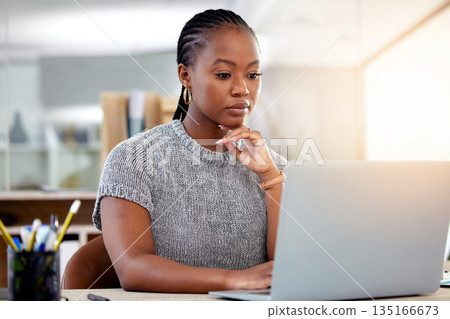 Laptop, research and a business black woman thinking while working at her desk in her office with flare. Computer, planning and idea with a serious young female employee reading an email at work Laptop, research and a business black woman thinking while working at her desk in her office with flare. Computer, planning and idea with a serious young female employee reading an email at work 135166673