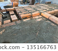 Fresh brickwork of a heating stove bench and firebox area. Close-up. 135166763