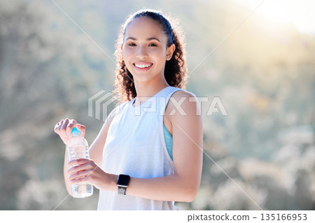 Happy woman, portrait smile and water in fitness for sustainability, hydration or break from running in nature. Fit, active and sporty female person or runner smiling with bottle for thirst in run 135166953