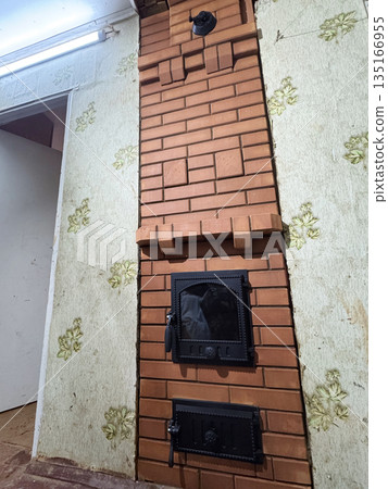 Fresh brickwork of a construction furnace. Front side. Wide shot. 135166955