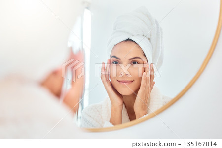 Mirror, woman and hands on face for skincare, check and anti aging cosmetic results in bathroom. Facial, beauty and female touching soft, glow and smooth skin after luxury dermatology routine at home Mirror, woman and hands on face for skincare, check and anti aging cosmetic results in bathroom. Facial, beauty and female touching soft, glow and smooth skin after luxury dermatology routine at home 135167014