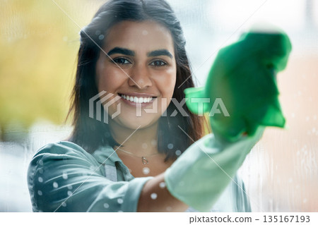 Housekeeping, portrait and cleaner cleaning the window with a cloth by her home or apartment. Female maid, housekeeper or wife washing the glass door with detergent product for bacteria, dirt or dust Housekeeping, portrait and cleaner cleaning the window with a cloth by her home or apartment. Female maid, housekeeper or wife washing the glass door with detergent product for bacteria, dirt or dust 135167193