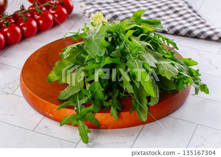 Raw green fresh arugula heap 135167304