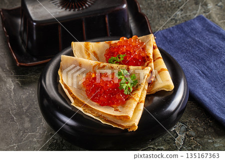 Russain traditional pancakes with red caviar Russain traditional pancakes with red caviar 135167363
