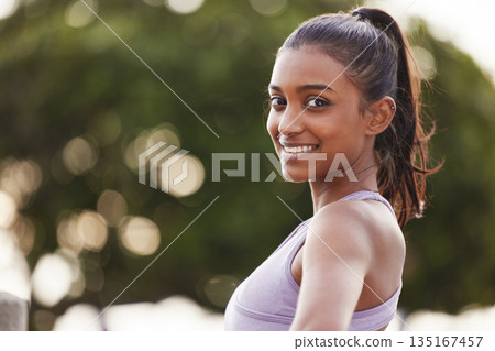 Woman, smile portrait and fitness outdoor of a Indian female person in park for exercise. Workout, mockup and sport of a runner athlete in nature for health, training and wellness with happiness Woman, smile portrait and fitness outdoor of a Indian female person in park for exercise. Workout, mockup and sport of a runner athlete in nature for health, training and wellness with happiness 135167457