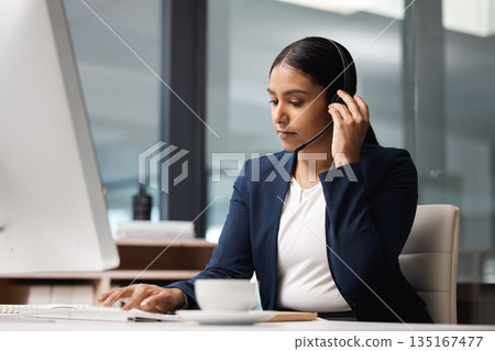 Computer, telemarketing and woman typing in call center office for customer service, help desk or technical support. Crm, contact us and female sales agent, business consultant or employee listening. 135167477