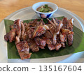 Thailand street food, grilled pork neck with Thai dipping sauce, close-up shot blurred background, no people. 135167604