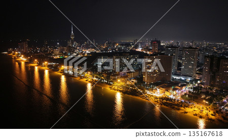 Pattaya cityscape at night showing beachfront hotels and high rise buildings 135167618