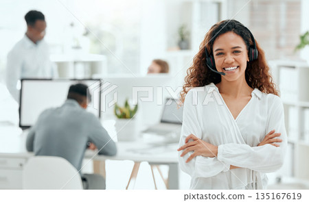 Call center woman, confident portrait and office with arms crossed, leader and pride with team in blurred background. Telemarketing manager, happy and smile for customer service, tech support or crm 135167619