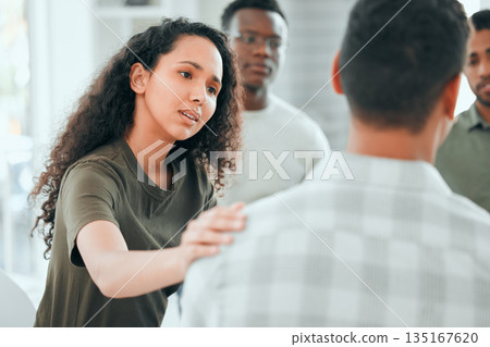Counseling, woman with hand on man shoulder for comfort and in support center with members. Mental health or depression, group therapy or rehabilitation and people sitting together for recovery Counseling, woman with hand on man shoulder for comfort and in support center with members. Mental health or depression, group therapy or rehabilitation and people sitting together for recovery 135167620