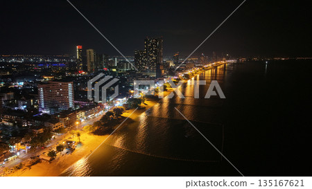 Pattaya city skyline illuminating beach and ocean at night Pattaya city skyline illuminating beach and ocean at night 135167621