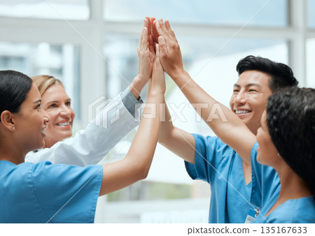 High five, happy or doctors with medical success in celebration of surgery results in hospital with bonus. Team work, winners or nurses smiling to celebrate targets, mission or winning goals together High five, happy or doctors with medical success in celebration of surgery results in hospital with bonus. Team work, winners or nurses smiling to celebrate targets, mission or winning goals together 135167633