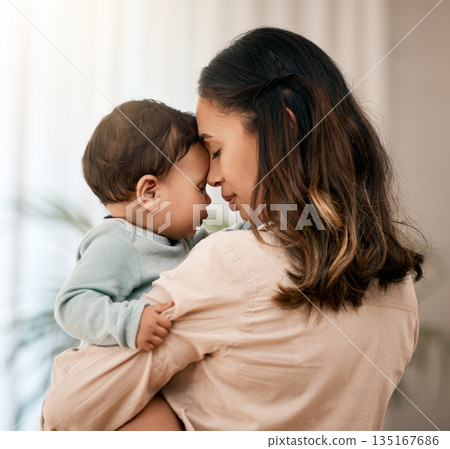 Face, hug and mother with baby in a living room with love, care and gratitude while bonding in their home. Calm, parent and mom with toddler girl embrace sweet and relax, loving and enjoy motherhood Face, hug and mother with baby in a living room with love, care and gratitude while bonding in their home. Calm, parent and mom with toddler girl embrace sweet and relax, loving and enjoy motherhood 135167686