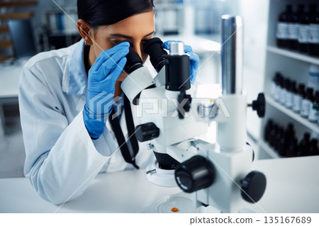 Science, scientist and woman with microscope in laboratory for medical research, analysis and test. Healthcare, biotechnology and female chemist with equipment for study, sample and examine virus Science, scientist and woman with microscope in laboratory for medical research, analysis and test. Healthcare, biotechnology and female chemist with equipment for study, sample and examine virus 135167689