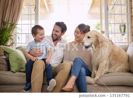 Family laugh, home and dog with child, mom and dad relax on sofa in living room with love. Pet animal, mother and father with young kid for fun, happiness and care in a house with golden retriever Family laugh, home and dog with child, mom and dad relax on sofa in living room with love. Pet animal, mother and father with young kid for fun, happiness and care in a house with golden retriever 135167791
