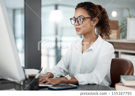 Professional woman at desk, working at computer with email and writing article at digital marketing agency. Focus, web design and typing at desktop PC with female copywriter, notes and SEO content 135167795