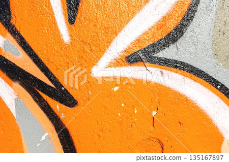 Orange Black Graffiti Abstract Shape on Textured Wall with Urban Street Art Style 135167897