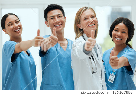 Teamwork, happy or portrait of doctors with thumbs up for healthcare, medical consulting or success. Thumb up, nurses or surgeons smiling with good hand gesture for diversity in hospital together Teamwork, happy or portrait of doctors with thumbs up for healthcare, medical consulting or success. Thumb up, nurses or surgeons smiling with good hand gesture for diversity in hospital together 135167993