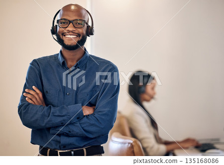 Call center, smile and black man with headset for customer service, crm or telemarketing support. Portrait of african person, consultant or agent with arms crossed for sales, contact us or help desk Call center, smile and black man with headset for customer service, crm or telemarketing support. Portrait of african person, consultant or agent with arms crossed for sales, contact us or help desk 135168086