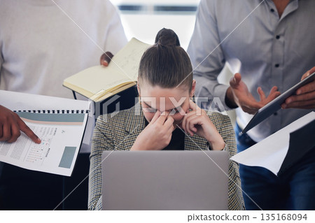 Laptop, stress and multitask with a business woman and demanding colleagues working in the office. Headache, anxiety and deadline pressure with an overwhelmed female employee at work on a computer Laptop, stress and multitask with a business woman and demanding colleagues working in the office. Headache, anxiety and deadline pressure with an overwhelmed female employee at work on a computer 135168094