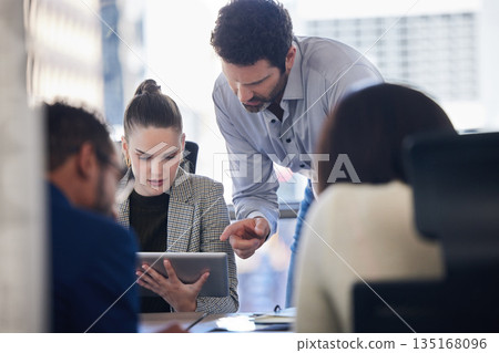 Digital tablet, discussion and business people doing research together in a meeting in the office. Technology, professional and corporate team working on a project in collaboration in the boardroom. Digital tablet, discussion and business people doing research together in a meeting in the office. Technology, professional and corporate team working on a project in collaboration in the boardroom. 135168096