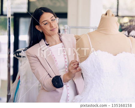 Fashion, designer and mannequin with woman in store for creative, planning and fabric. Clothes, tailor and sewing with female employee and wedding dress for small business, boutique and manufacturing 135168158
