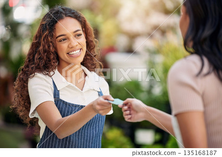 Woman waiter, credit card and payment at a coffee shop with barista and smile outdoor. Purchase, working and shopping with customer service and a female retail worker with happiness from cafe pay 135168187
