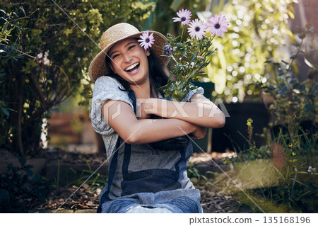 Florist woman, garden and flowers in nursery, smile and hug plant with excited face for sustainable small business. Girl, entrepreneur and love for plants, growth and nature with happiness in spring Florist woman, garden and flowers in nursery, smile and hug plant with excited face for sustainable small business. Girl, entrepreneur and love for plants, growth and nature with happiness in spring 135168196
