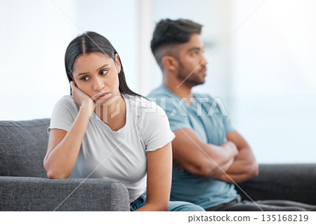 Couple, fight and woman feeling sad and depressed on living room sofa with relationship problem. Divorce talk, cheating anxiety and marriage crisis of young people on a lounge couch at home thinking Couple, fight and woman feeling sad and depressed on living room sofa with relationship problem. Divorce talk, cheating anxiety and marriage crisis of young people on a lounge couch at home thinking 135168219