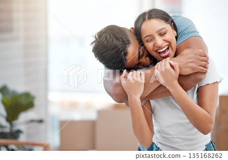 Hug, love and couple laugh in new home excited for property, apartment and real estate investment, Relationship, house and man and woman embrace, laughing and happy in living room on moving day Hug, love and couple laugh in new home excited for property, apartment and real estate investment, Relationship, house and man and woman embrace, laughing and happy in living room on moving day 135168262